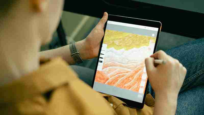 A person sketching colorful digital art on a tablet using a stylus, showcasing creativity and technology., tags: kunstenaars van - pexel