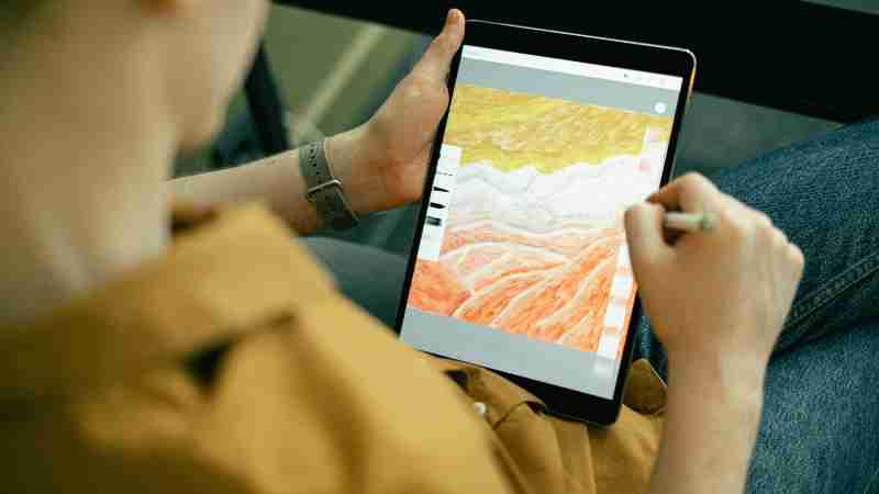 A person sketching colorful digital art on a tablet using a stylus, showcasing creativity and technology., tags: digitale kunst - pexel
